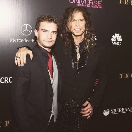 Taj Monroe Tallarico and his father Steven Tyler photographed together at a public event. 